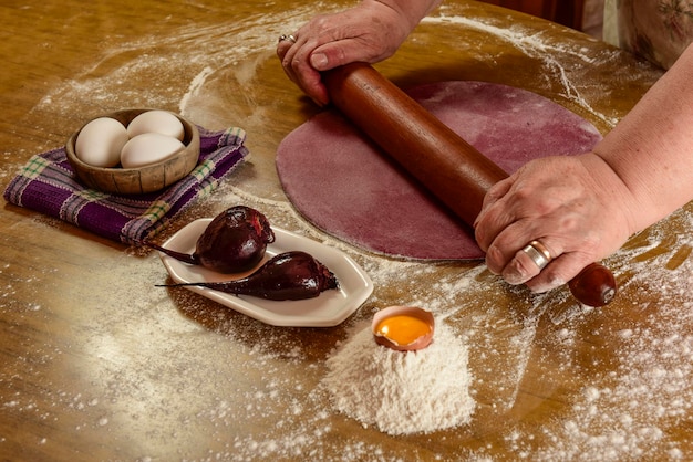 Hands preparing dough